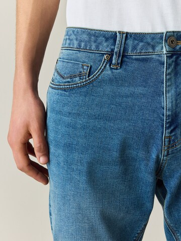 Coupe slim Jean 'Motion Flex' Next en bleu