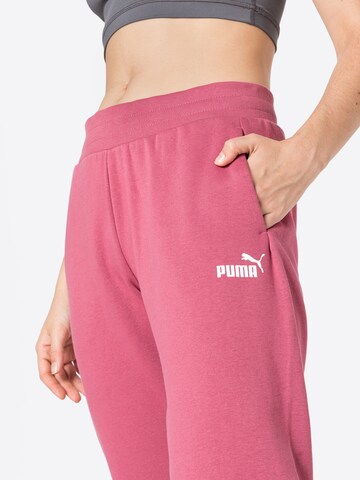 PUMA Zwężany krój Spodnie sportowe w kolorze fioletowy