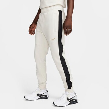 Nike Sportswear Tapered Pants in Beige