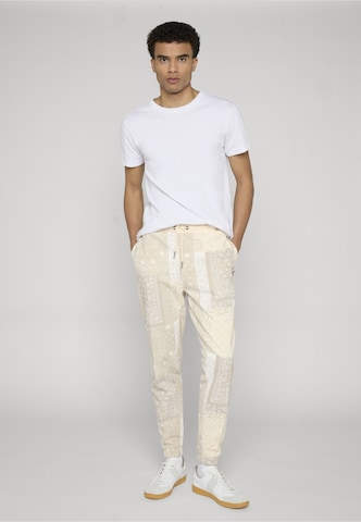 Loosefit Pantalon chino Karl Kani en beige : devant