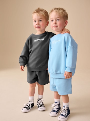 Next Träningsoverall i blå: framsida