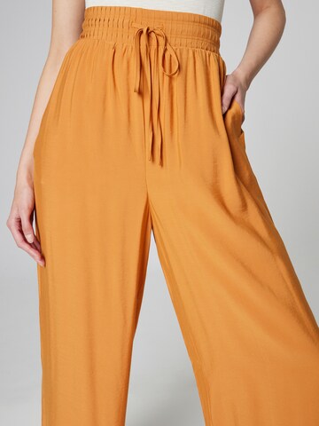 Guido Maria Kretschmer Women Wide leg Pleat-front trousers 'Janay' in Orange