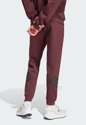 ADIDAS SPORTSWEAR Tapered Sports trousers 'Future Icons' in Red