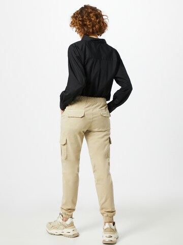 Tapered Pantaloni cargo di Urban Classics in beige