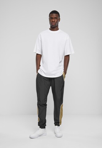 Urban Classics Tapered Sports trousers in Black: front