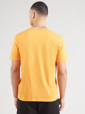 Maglietta di Champion Authentic Athletic Apparel in arancione