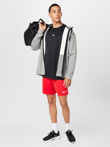 NIKE - regular Pantalón deportivo en rojo