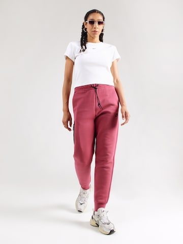 Nike Sportswear Tapered Nadrág 'TCH FLC' - rózsaszín