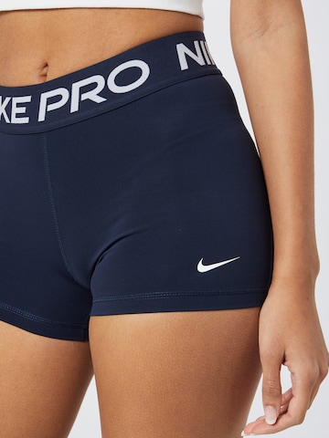 NIKE Skinny Športne hlače 'Pro' | modra barva