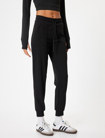 Koton Tapered Trousers in Black: front