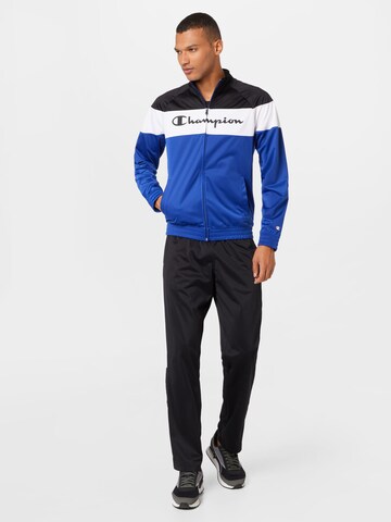 Champion Authentic Athletic Apparel Tracksuit in Blue: front