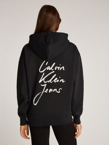 Calvin Klein JeansSweater majica - crna boja: prednji dio