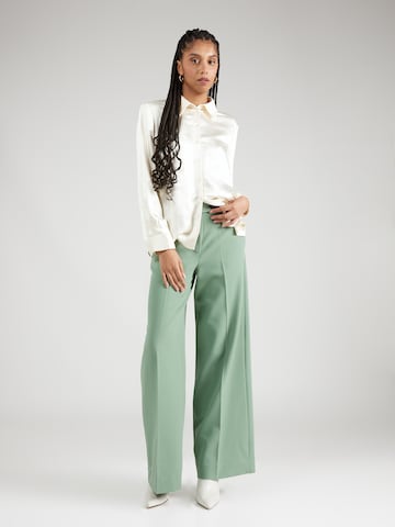 Wide leg Pantaloni con piega frontale 'Harper' di Lovechild 1979 in verde