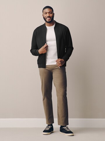 Next - Chaqueta de entretiempo 'Motionflex' en negro