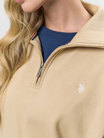 U.S. POLO ASSN. Neulepaita ' Katie ' värissä beige