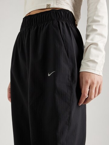 Tapered Pantaloni sport 'FAST' de la NIKE pe negru