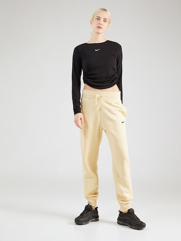 Effilé Pantalon 'Phoenix Fleece' Nike Sportswear en jaune