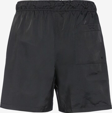 Loosefit Pantalon 'Club' Nike Sportswear en noir