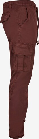 Effilé Pantalon cargo Urban Classics en rouge