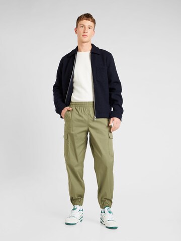 Tapered Pantaloni cargo di new balance in verde