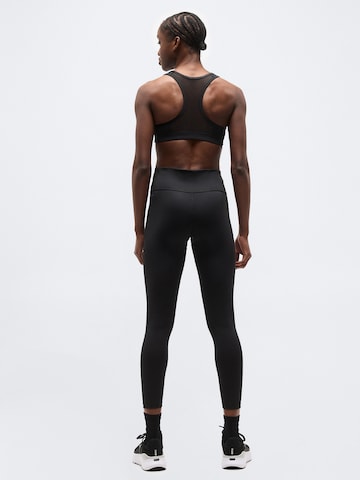 PUMA Skinny Sportnadrágok 'Strong' - fekete