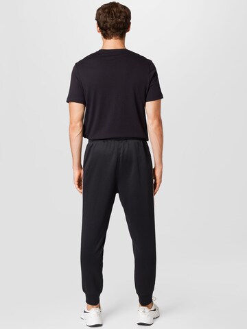 Nike Sportswear Tapered Broek in Zwart