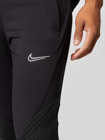 NIKE - Regular Calças de desporto 'Strike' em preto