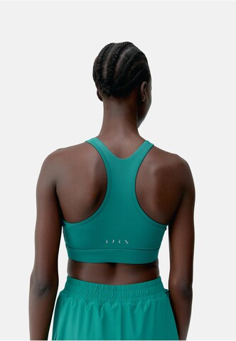 Born Living Yoga Bustier Sport-BH 'Bikila' in Grün