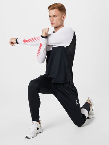 Tricou funcțional 'Clash' de la NIKE pe negru