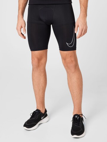 Skinny Pantalon de sport NIKE en noir : devant