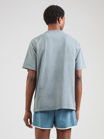 NIKE Functioneel shirt 'M90 GYM HERITAGE' in Grijs
