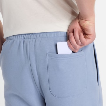 new balance Tapered Broek 'Essentials' in Blauw