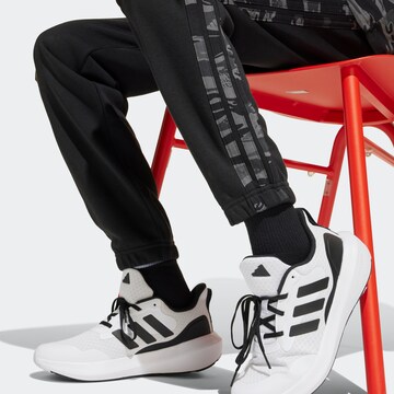 Effilé Pantalon de sport 'Essentials' ADIDAS SPORTSWEAR en noir
