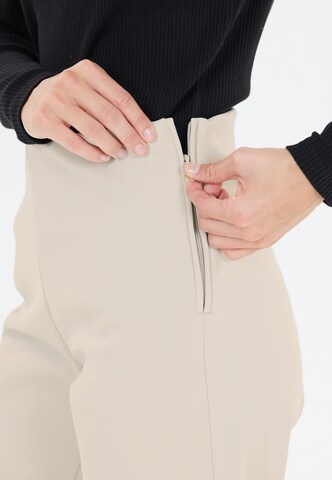 Athlecia Regular Workout Pants 'Vikki' in Beige