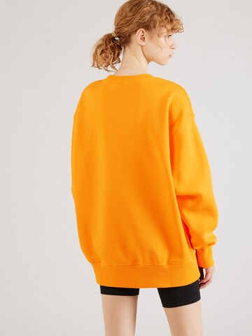 Nike Sportswear Sweatshirt 'PHOENIX FLEECE' in Orange