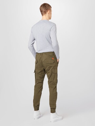 ALPHA INDUSTRIES Tapered Παντελόνι cargo 'Airman' σε πράσινο