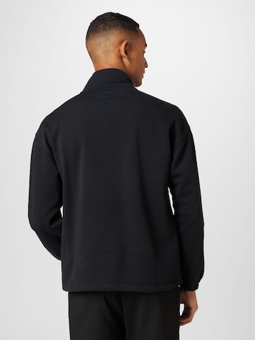 LEVI'S ® Sweatshirt 'RLXD Graphic 1/4 Zip Pch' in Schwarz