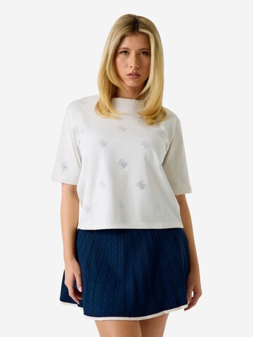 Top di GUESS in bianco: frontale