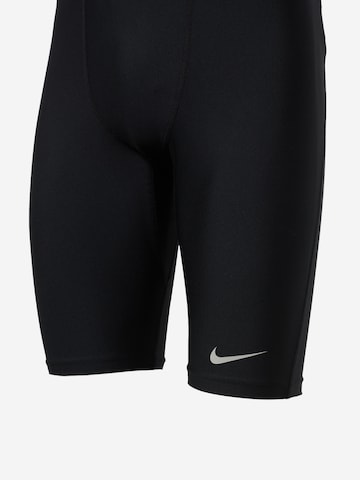 Skinny Pantaloni sport 'FAST' de la NIKE pe negru