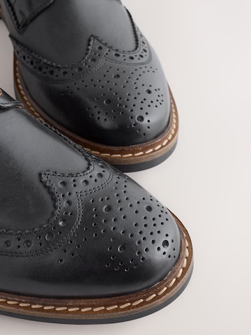 Boots stringati di Next in nero
