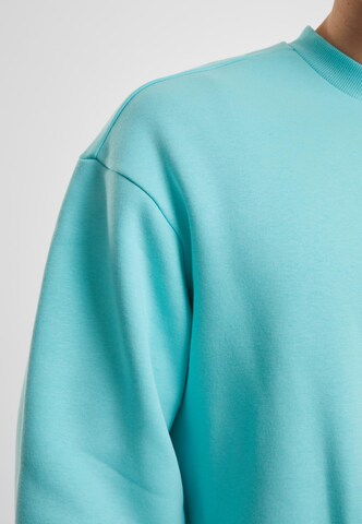 Sweat-shirt Urban Classics en bleu