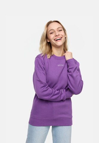 Sweat-shirt smiler. en violet