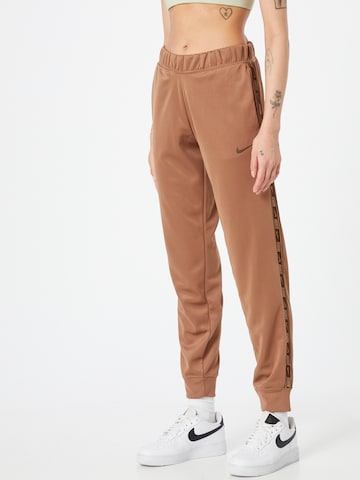 Nike Sportswear Pants in Brown: front