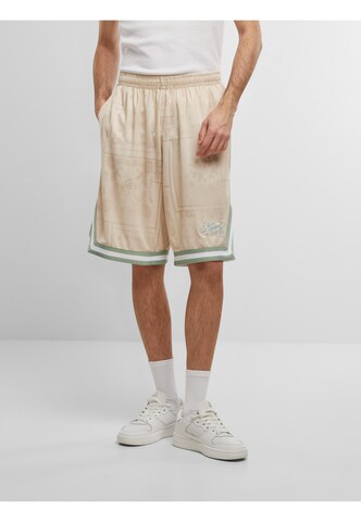 Karl Kani Loose fit Pants in Beige: front