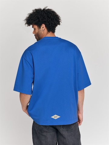 LYCATI exclusive for ABOUT YOU Shirt 'Tie' in Blau