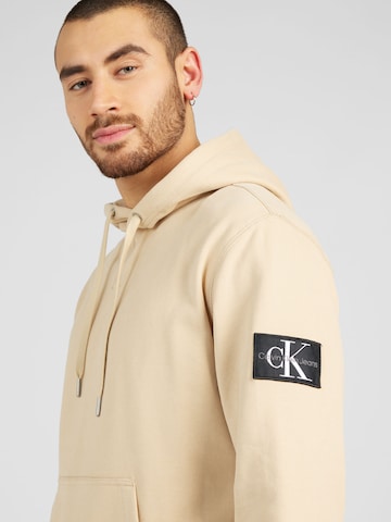 Calvin Klein Jeans كنزة رياضية بلون بيج