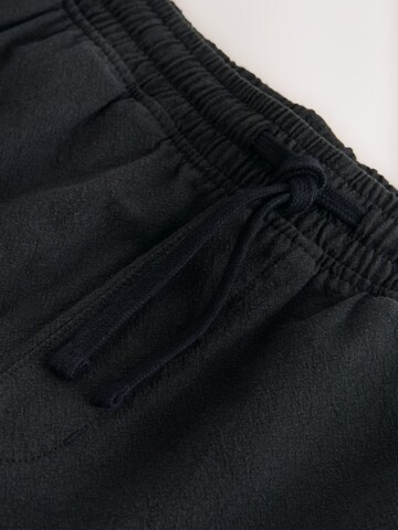 Next Loosefit Shorts in Schwarz