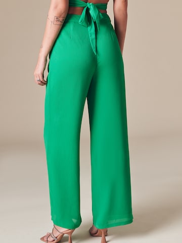 ABOUT YOU x Laura Giurcanu Wide leg Pleat-Front Pants 'Carina' in Green