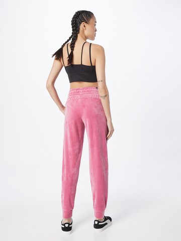 PUMA Tapered Sportbroek in Roze