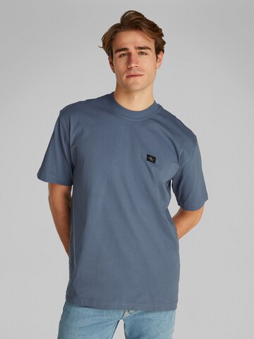 Calvin Klein Jeans Koszulka w kolorze szary: przód